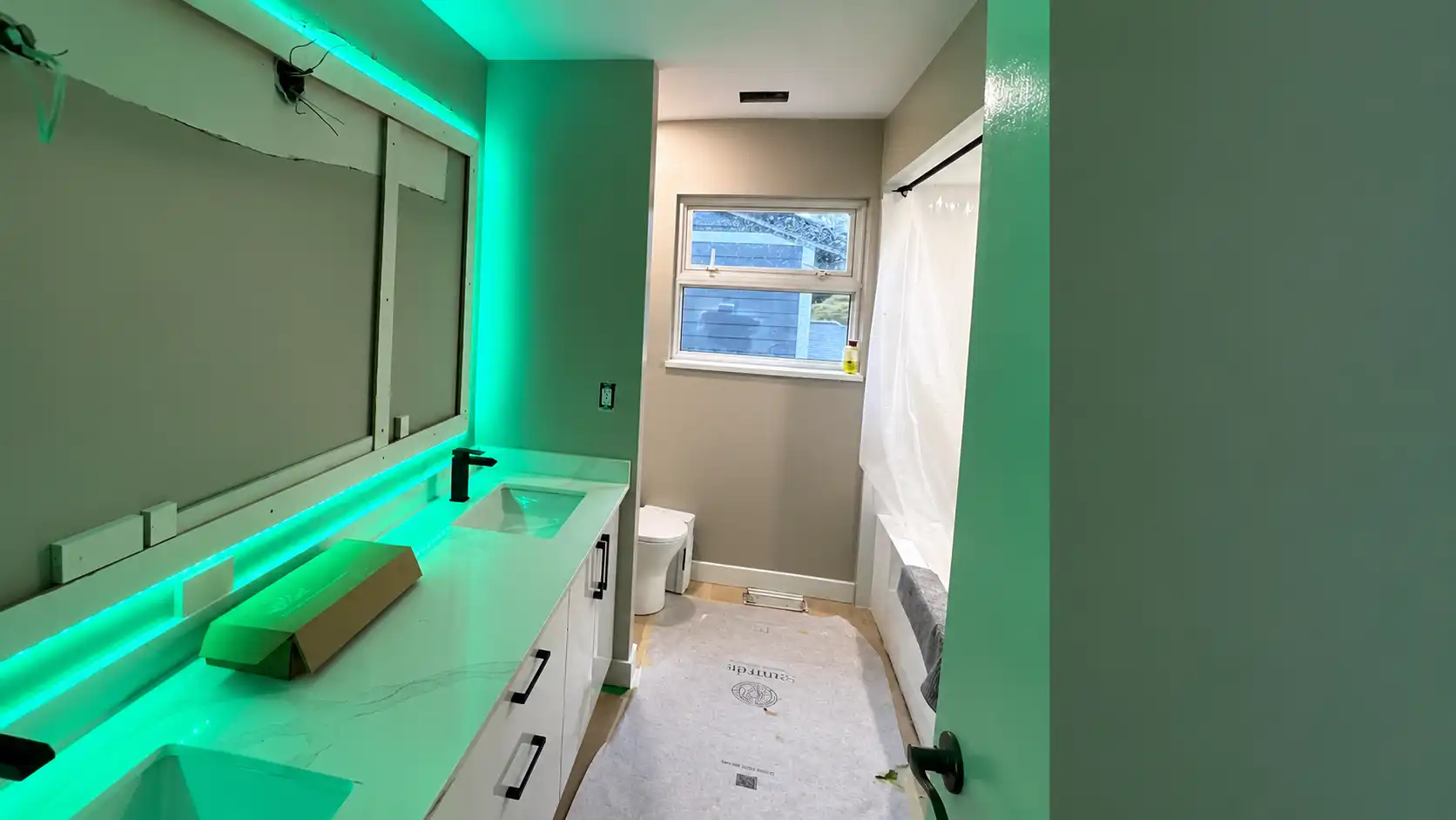Bathroom wall and floor tile with even grout lines around fixtures